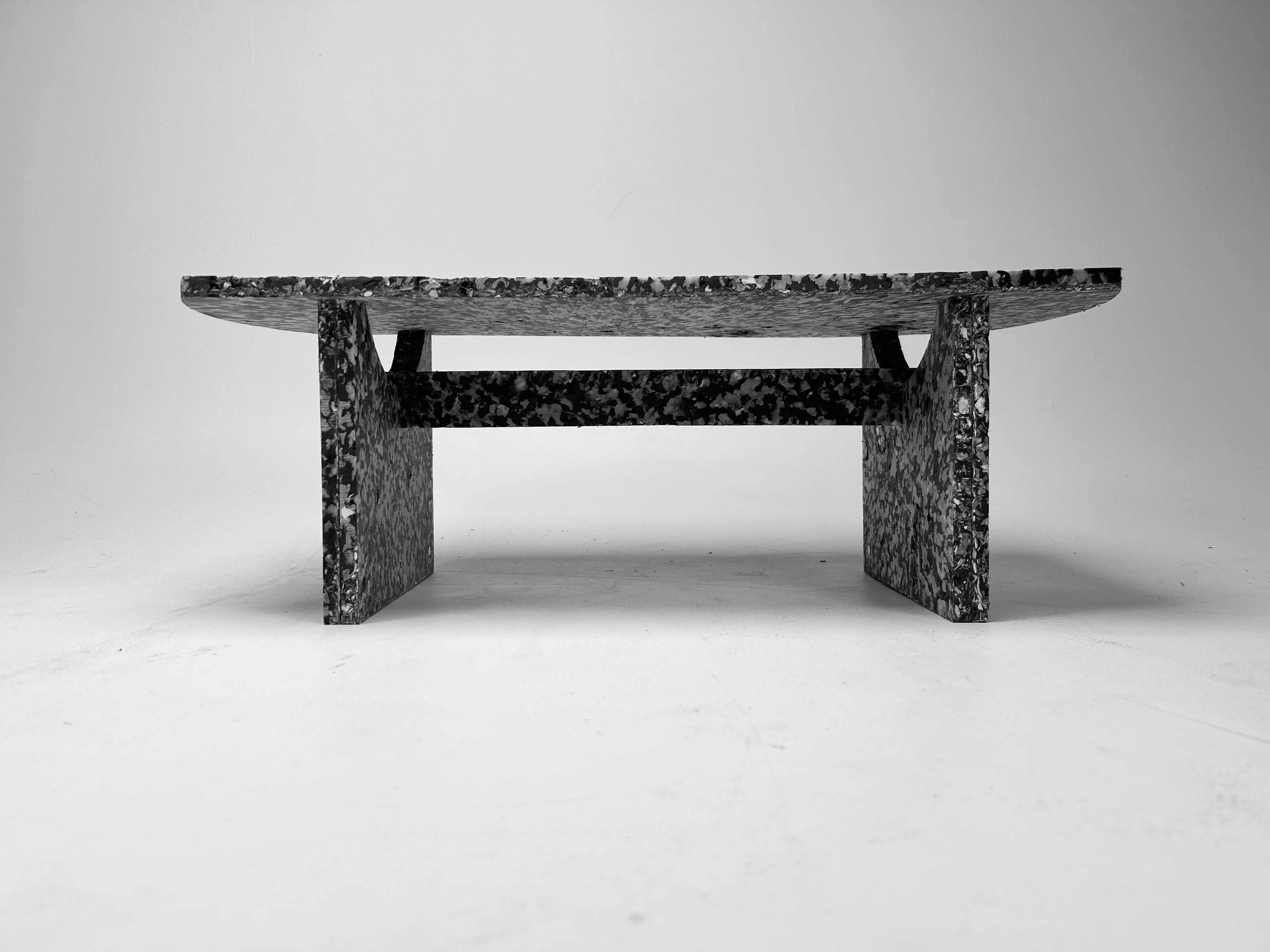 Side elevation of the finished bench showing the arc of the seat and the stretcher joint.